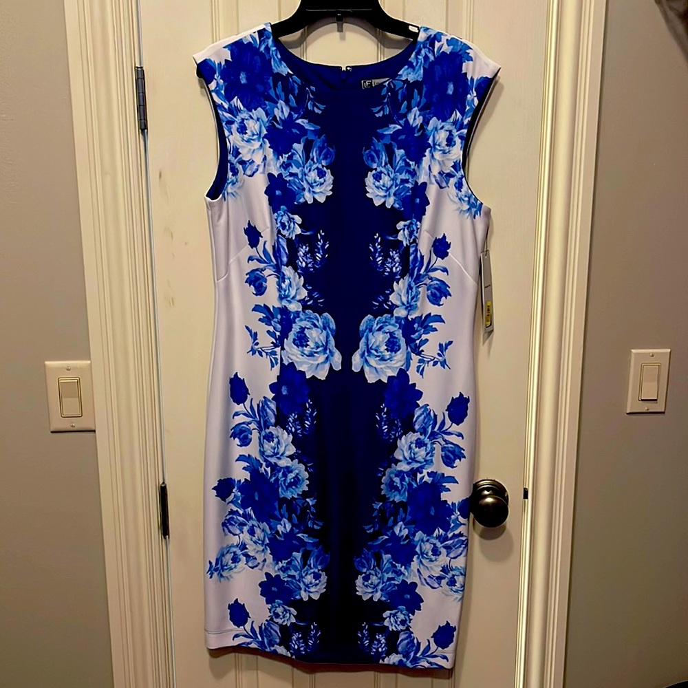 Brand new dress, size 12, has dark blue inner lining, bought from Dillards